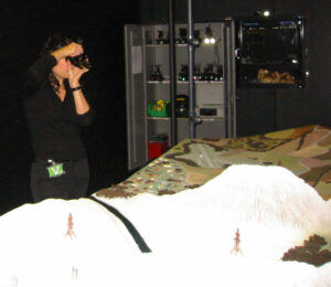 Trying night vision goggles for the first time at RAF Henlow, looking at an artificial terrain designed to prevent overconfidence in pilots by showing the weaknesses in the technology.