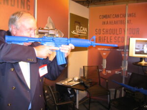 A stallholder at Night Vision 2006 demonstrating the use of the sights his company was selling.