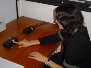 My chance to be a guinea pig in a University of Oxford experiment. I react to lights on the table and buzzes through the bands in my arm by pressing buttons with my finger and pedals with my feet.