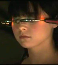 Photo of a character from the TV show Caprica wearing a virtual headset